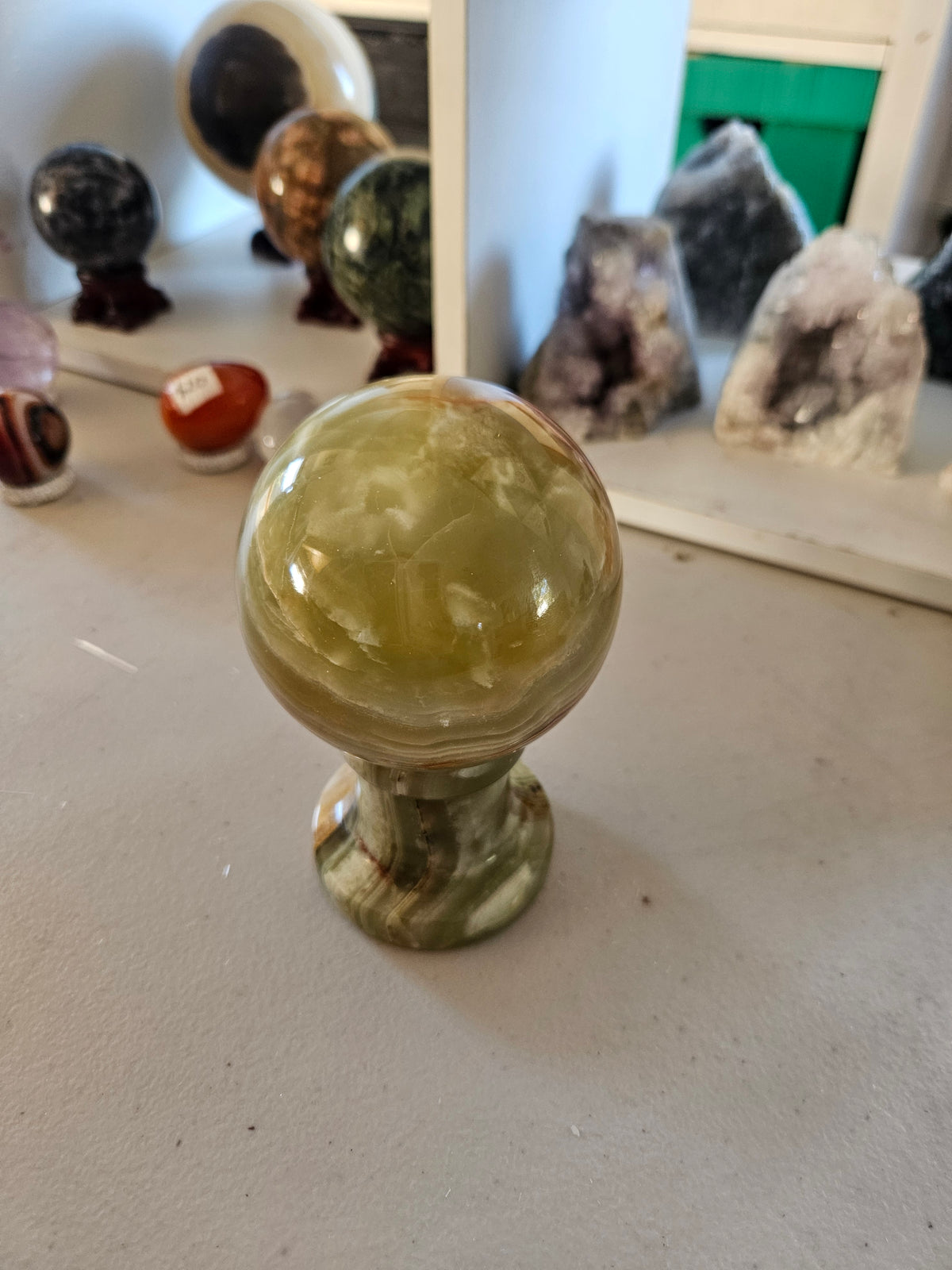 Green Calcite Sphere with Matching Stand